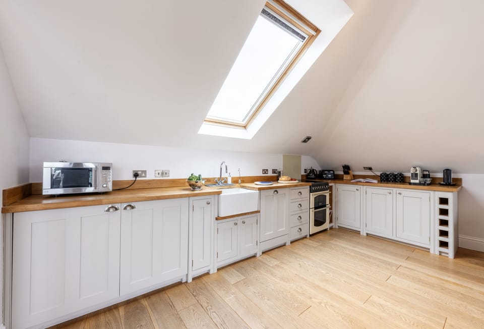 9 Fernhill Penthouse, Carbis Bay. Gorgeous open-plan kitchen with oven and hob, dishwasher, fridge, freezer, microwave and Nespresso coffee machine