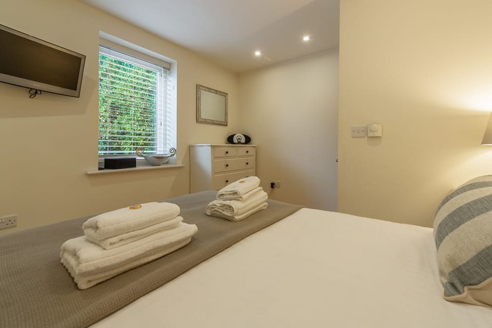 6 Sandy Lane, Carbis Bay. First floor: Bedroom two has a wall mounted Smart television