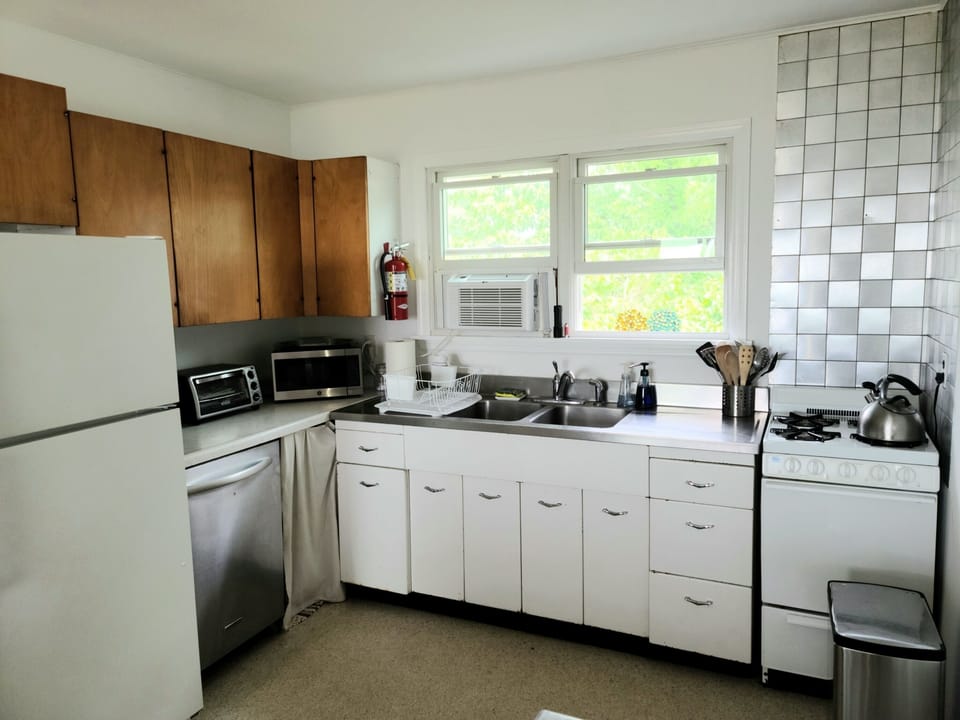 Kitchen with dishwasher/ window AC unit