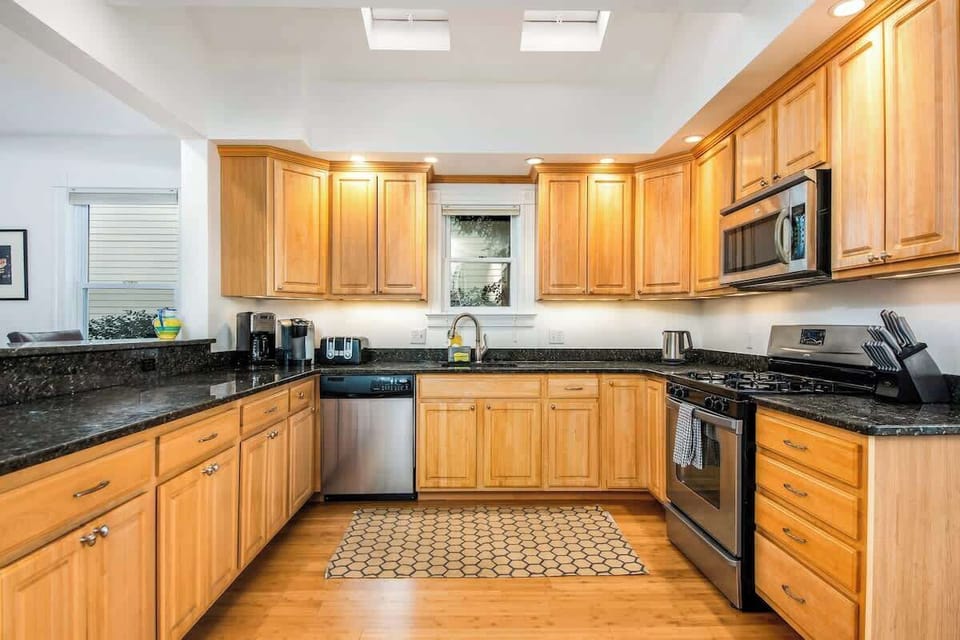 The open concept dining room and kitchen offers an abundance of space for several cooks in the kitchen and friends and family to dine. Easy access through the slider to the outdoor patio allows for additional living space.