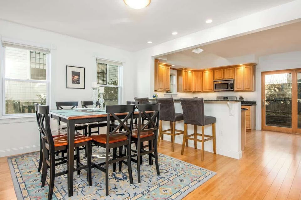 The open concept dining room and kitchen offers an abundance of space for several cooks in the kitchen and friends and family to dine.