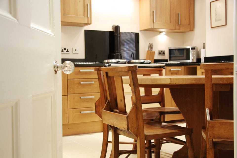Fully equipped contemporary Kitchen with three oven AGA, dining table to seat 8