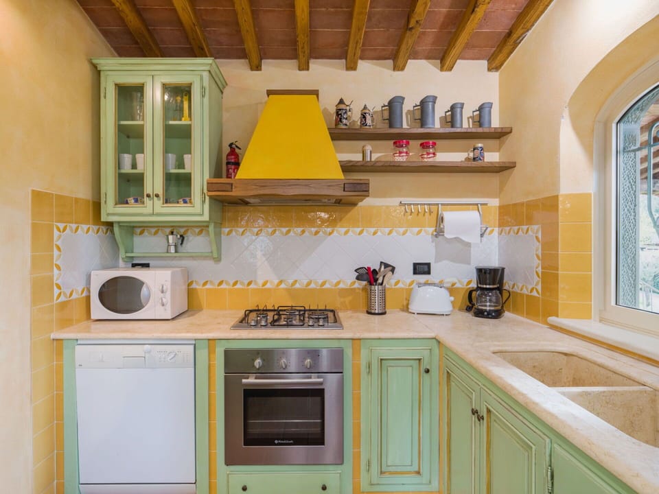 Kitchen, Interior Design, Kitchen Appliance, Furniture, Flooring, Countertop, Wall, Major Appliance, Wood, Cabinetry