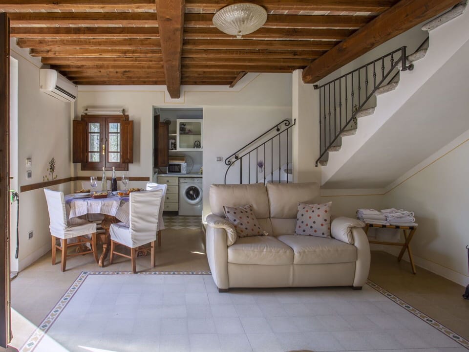 Furniture, Property, Ceiling Fan, Cabinetry, Table, Couch, Lighting, Picture Frame, Wood, Countertop