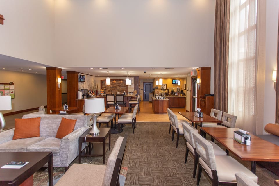 Inviting dining space with a well-stocked complimentary breakfast area.