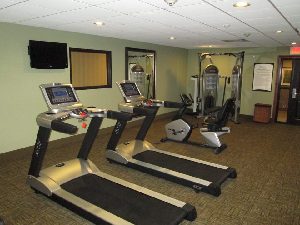 Fitness center with treadmills and exercise equipment.