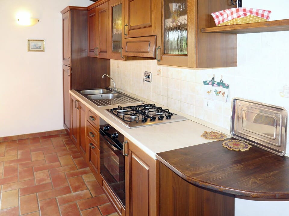 Brown, Cabinetry, Countertop, Property, Furniture, Kitchen Appliance, Kitchen Stove, Building, Cooktop, Home Appliance