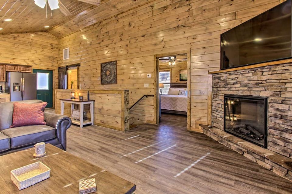 Beautiful stone fireplace in the main level living area & 65" smartv