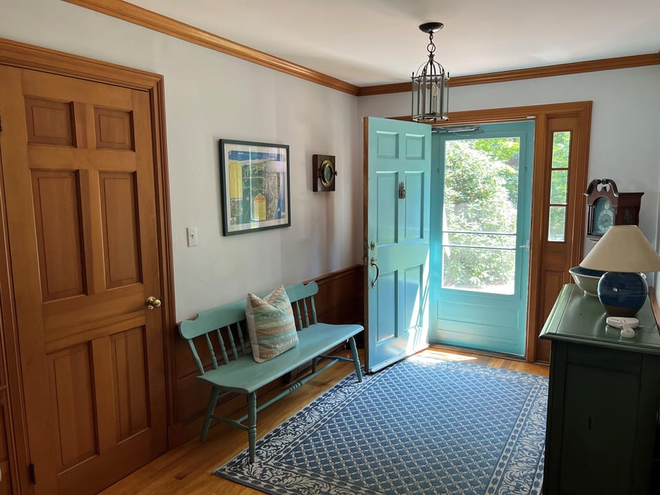 Front Hallway with Coat Closet and Bench