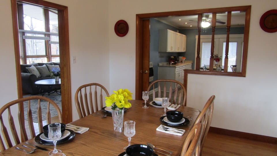 Dining room looks into spacious, well-stocked kitchen and large living room!