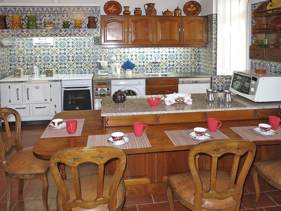 Furniture, Cabinetry, Countertop, Property, Table, Chair, Wood, Kitchen, Flooring, Interior Design