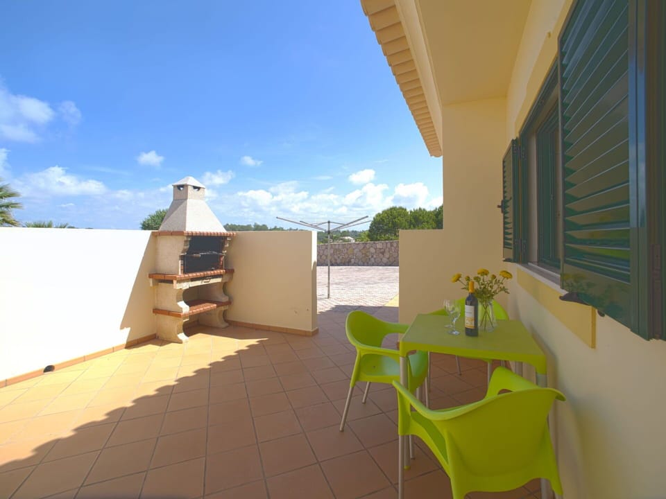 Sky, Property, Building, Cloud, Furniture, Chair, Shade, Window, Plant, Wood