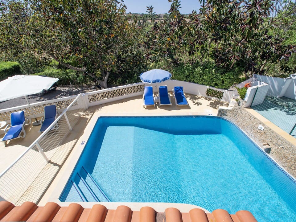 Water, Property, Swimming Pool, Building, Blue, Plant, Azure, Outdoor Furniture, Tree, Sky