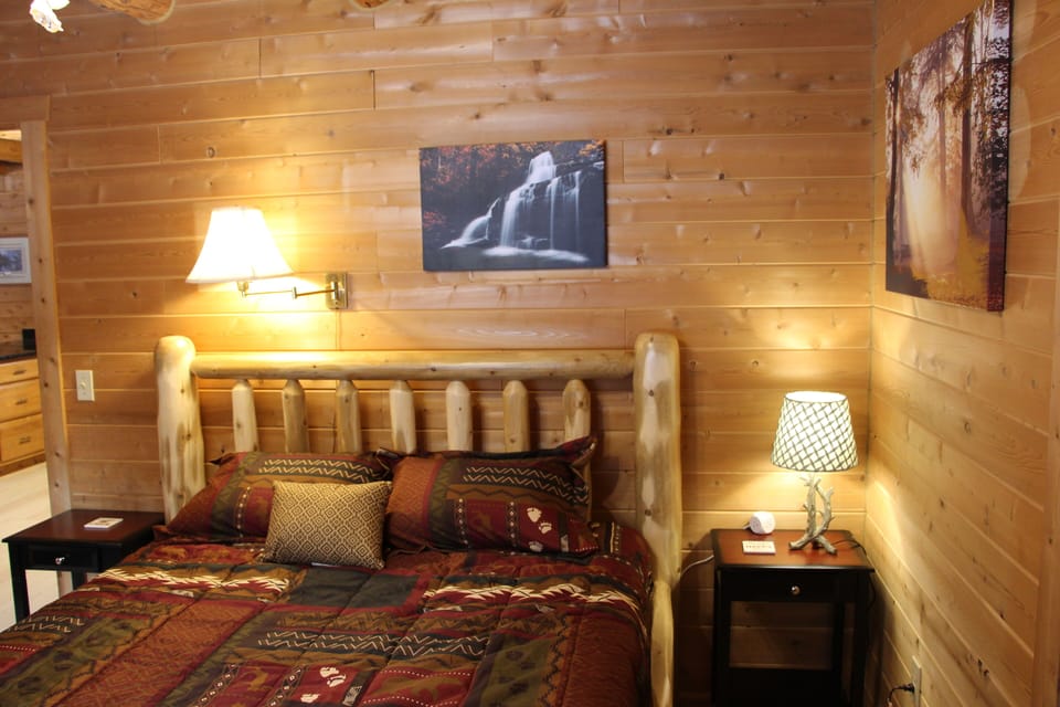 Master bedroom 1st floor.  Locally made cedar log beds