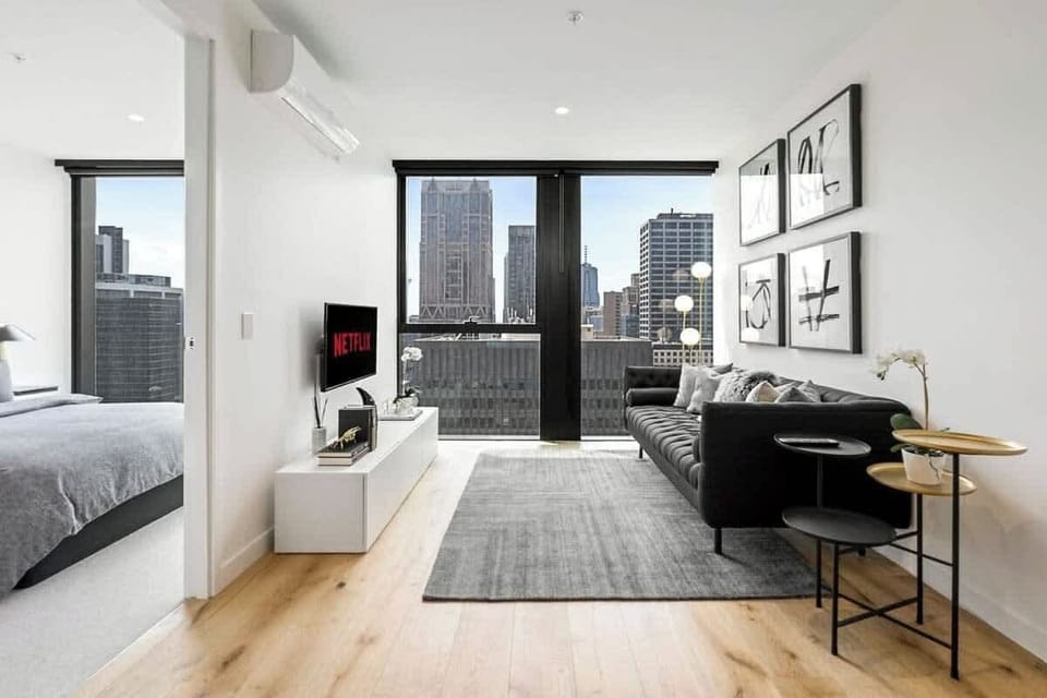 Open-planned living room with flat-screen TV 