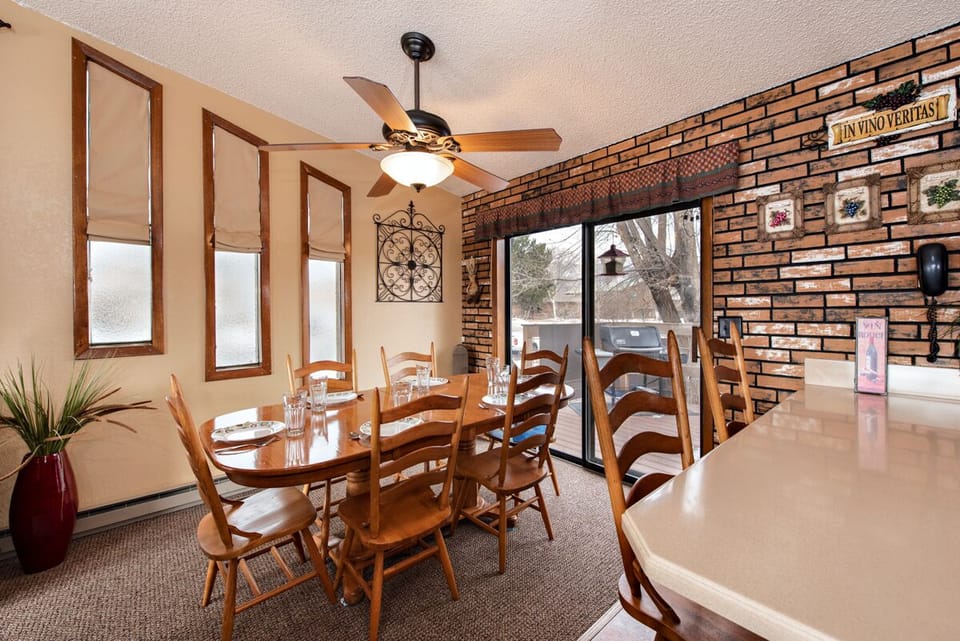 Dining room, bar and patio door leading to back deck (fan is not functional)