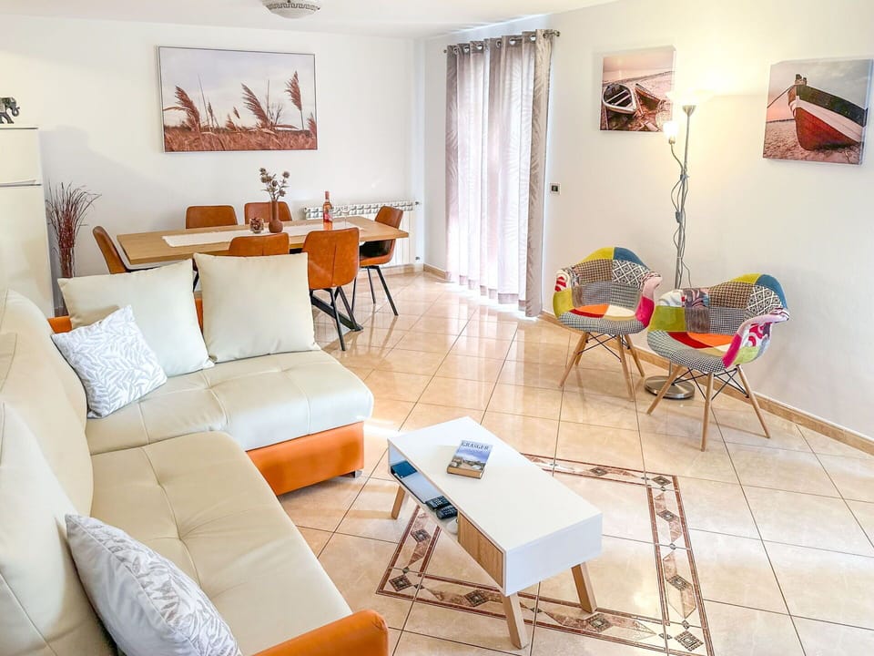 Furniture, Interior Design, Couch, Flooring, Floor, Living Room, Apartment, Room, Chair, Table