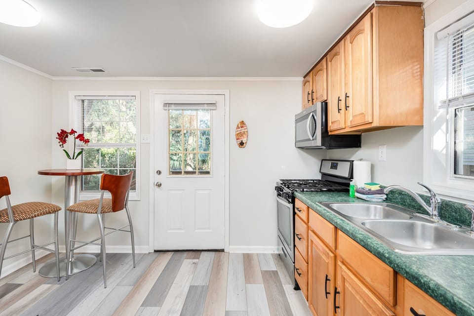 The kitchen has direct assess to the back yard, and grill spot.