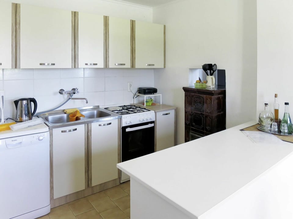 Room, Countertop, Kitchen, Property, Furniture, Major Appliance, Interior Design, Yellow, Cabinetry, Floor