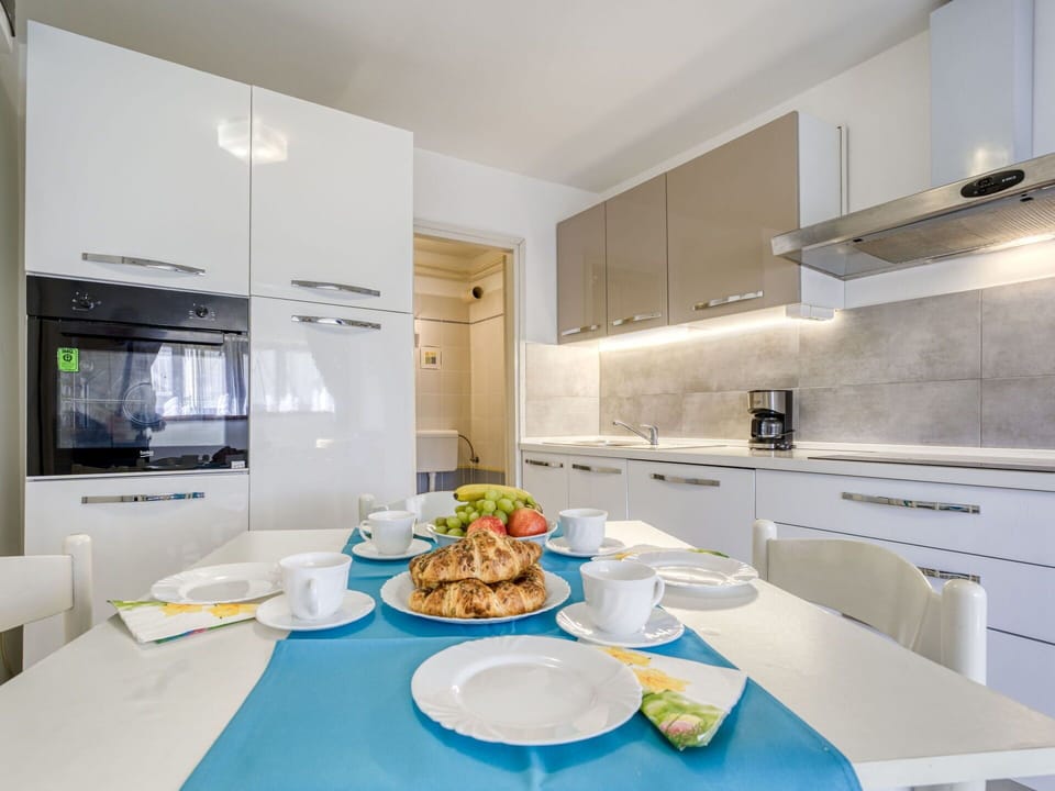 Interior Design, Kitchen, Countertop, Flooring, Kitchen Appliance, Major Appliance, Furniture, Ceiling, Floor, Cabinetry