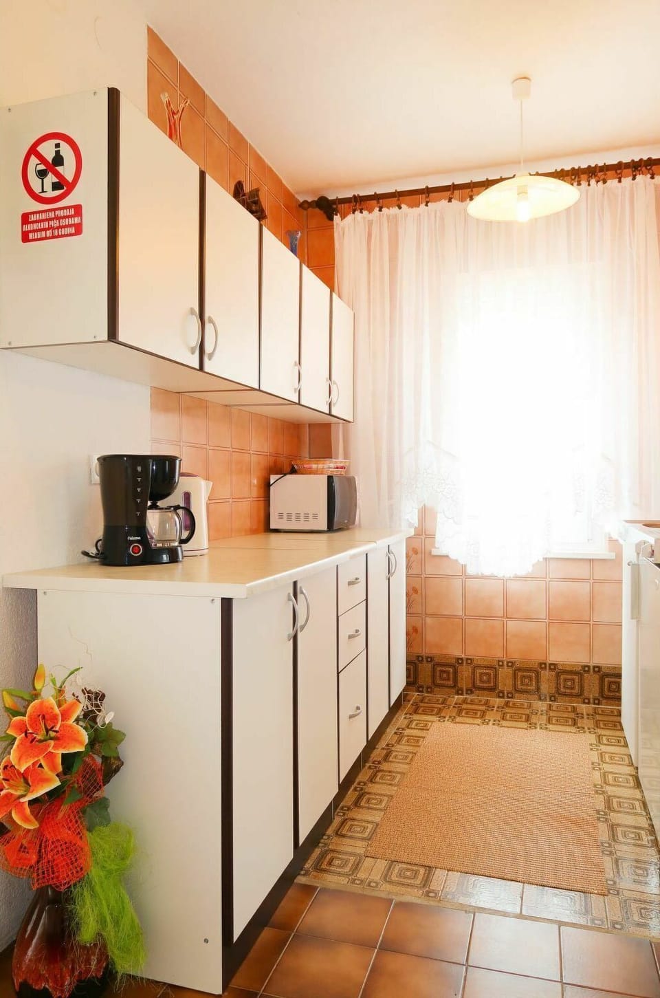Cabinetry, Building, Countertop, Orange, Plant, Flower, Wood, Kitchen, Interior Design, Window