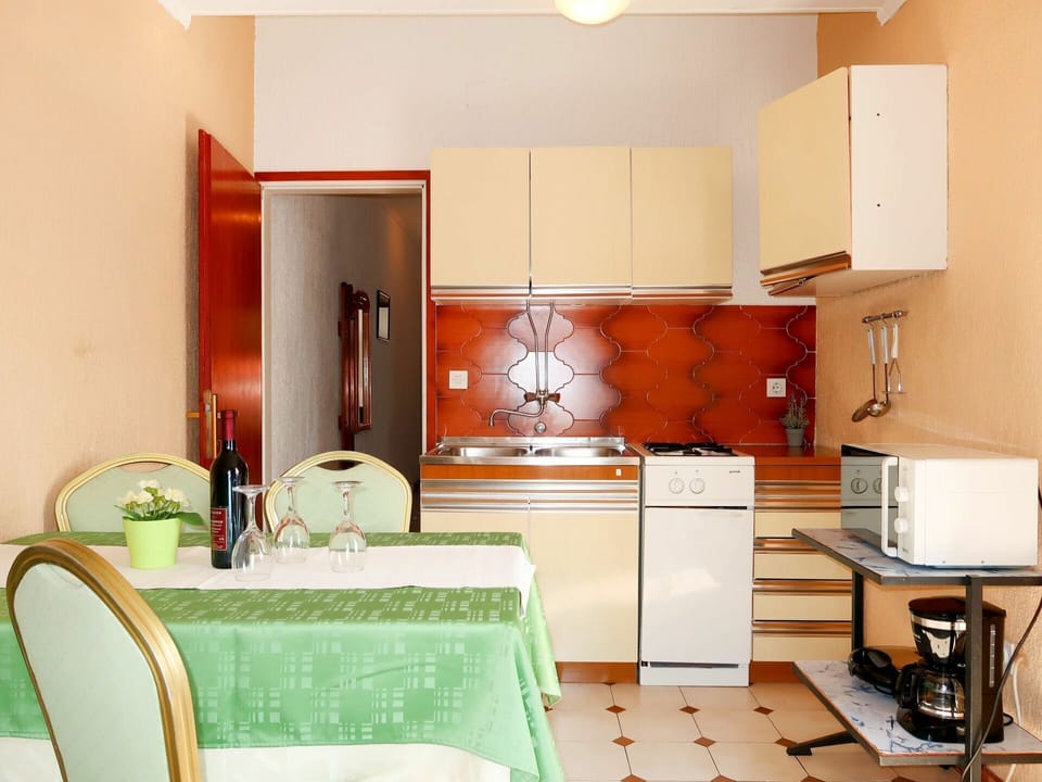 Room, Furniture, Property, Orange, Interior Design, Green, Kitchen, Building, Cabinetry, Yellow