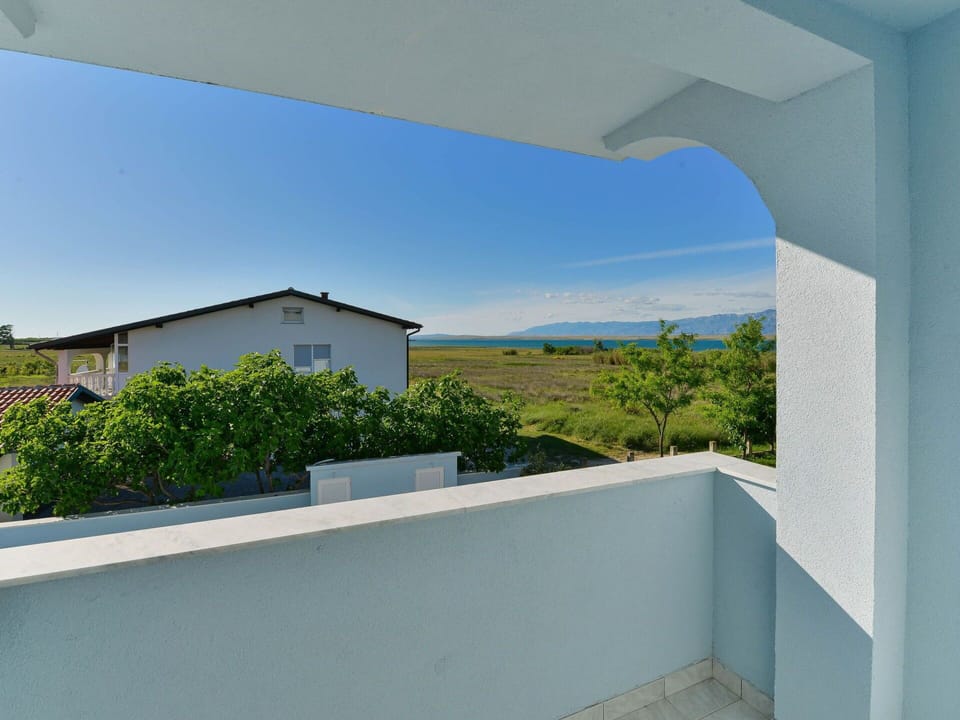 Sky, Plant, Azure, Shade, Land Lot, Building, Rectangle, Composite Material, Landscape