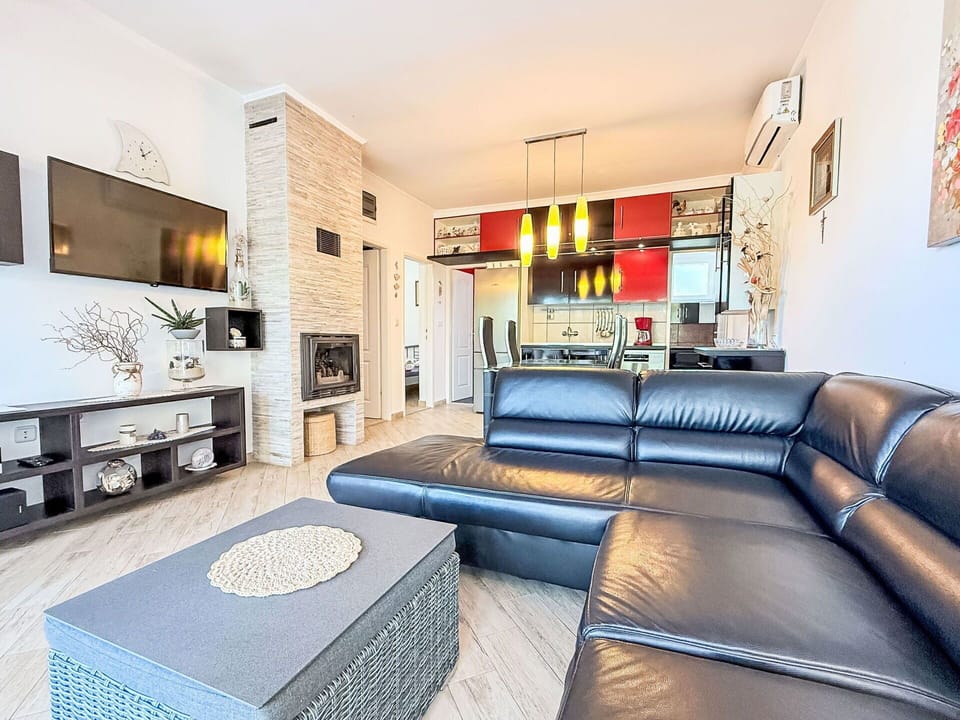 Furniture, Couch, Interior Design, Flooring, Living Room, Ceiling, Floor, Room, Television, Lighting