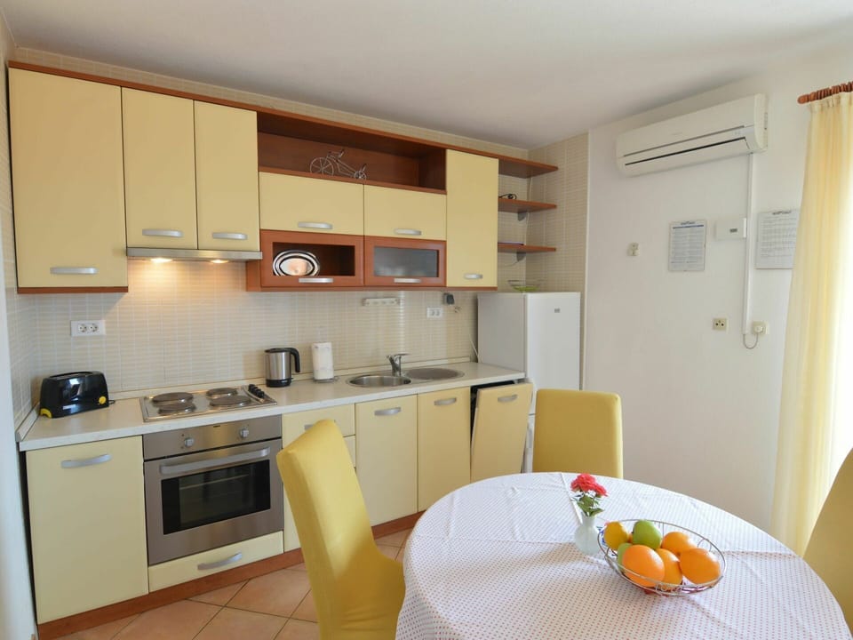 Room, Kitchen, Furniture, Property, Cabinetry, Yellow, Building, Countertop, Interior Design, House