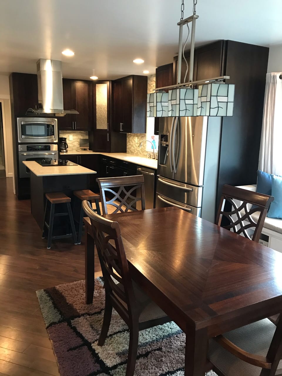 Open kitchen and dining area perfect for making and sharing a family dinner.