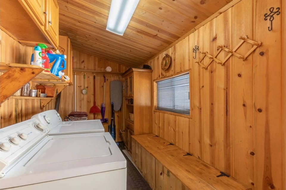 Washer and dryer with large long bench and natural light are downstairs for your convenience.