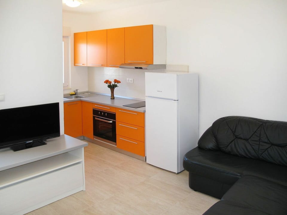 Room, Furniture, Property, Orange, Floor, Interior Design, Building, Cabinetry, Yellow, House