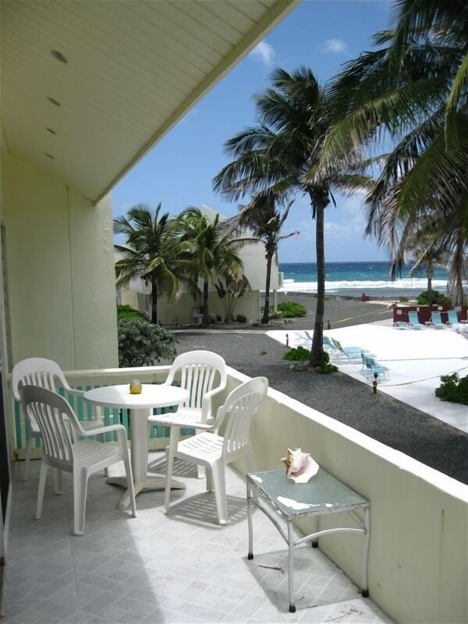 Relax in the noon time Sun on the private Balcony, as the Pelicans fly overhead
