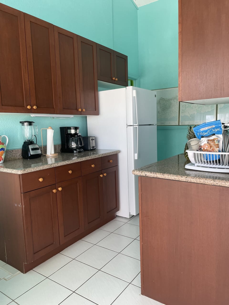 Stove, microwave, sink, toaster.  Fridge, coffeemaker, Tropical Drink Blender