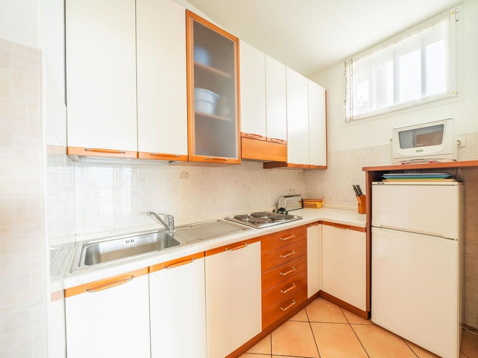 Cabinetry, Countertop, Property, Sink, Building, Kitchen Sink, Tap, Kitchen Stove, Kitchen, Wood