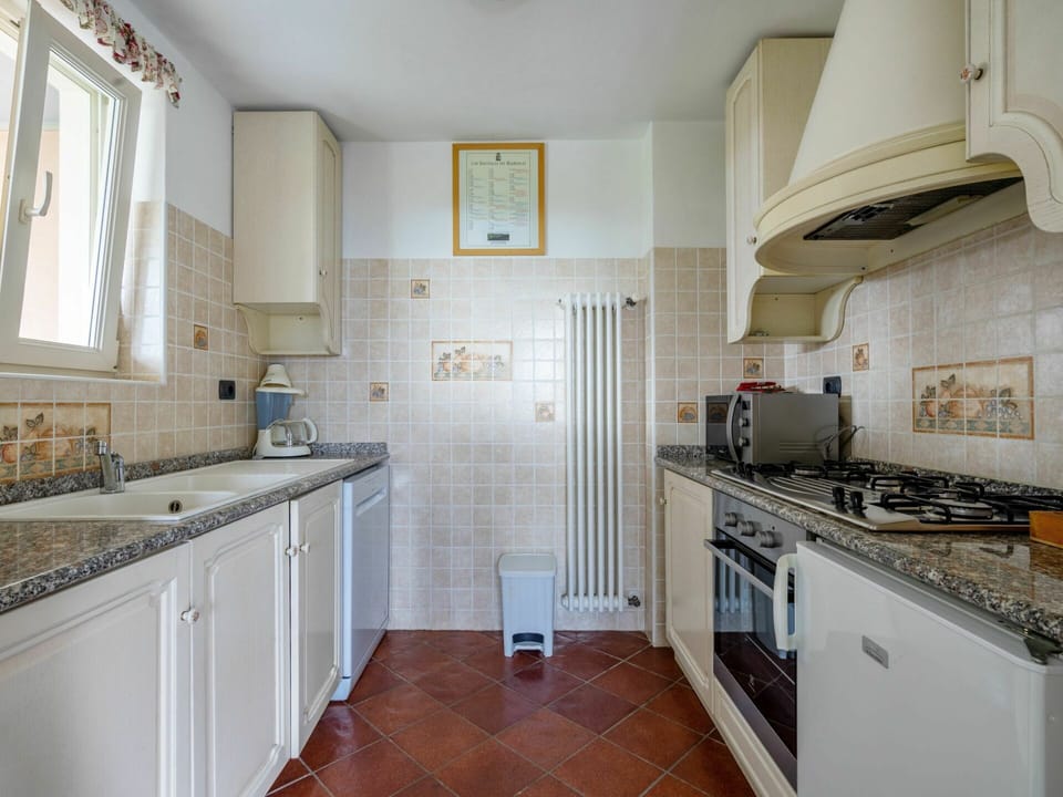 Cabinetry, Countertop, Window, Kitchen Stove, Kitchen Sink, Kitchen Appliance, Kitchen, Sink, Wood, Lighting
