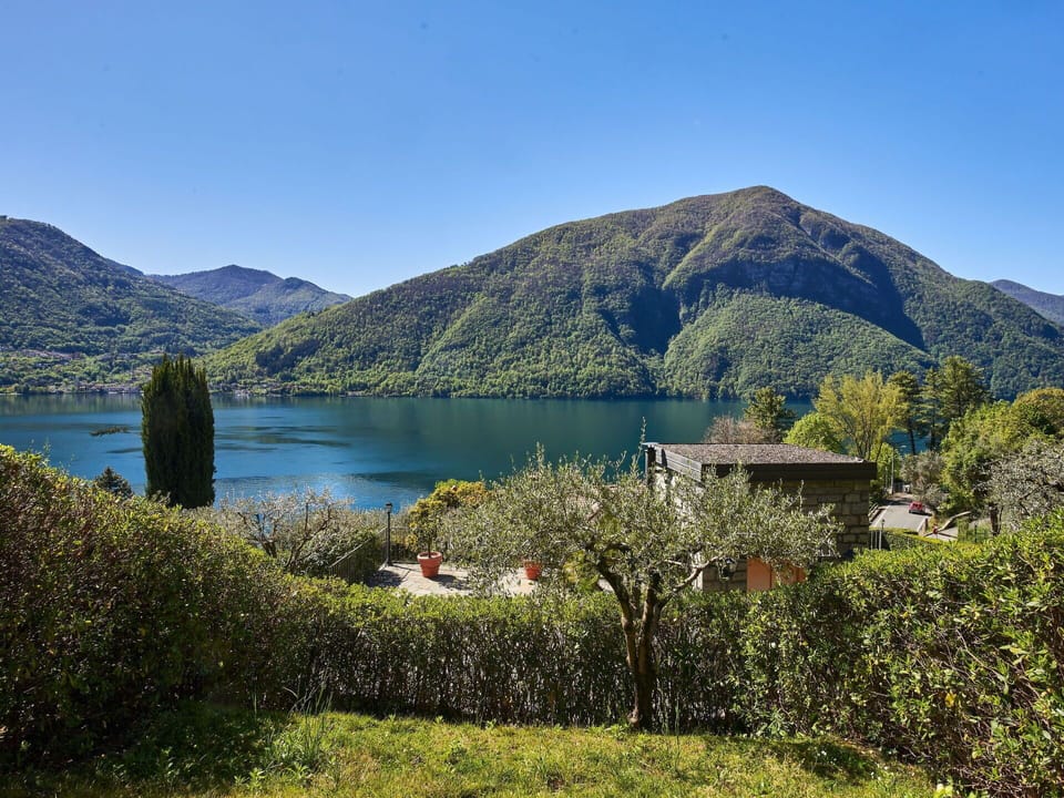 Water, Sky, Plant, Mountain, Natural Landscape, Lake, Tree, Grass, Mountainous Landforms, Rural Area