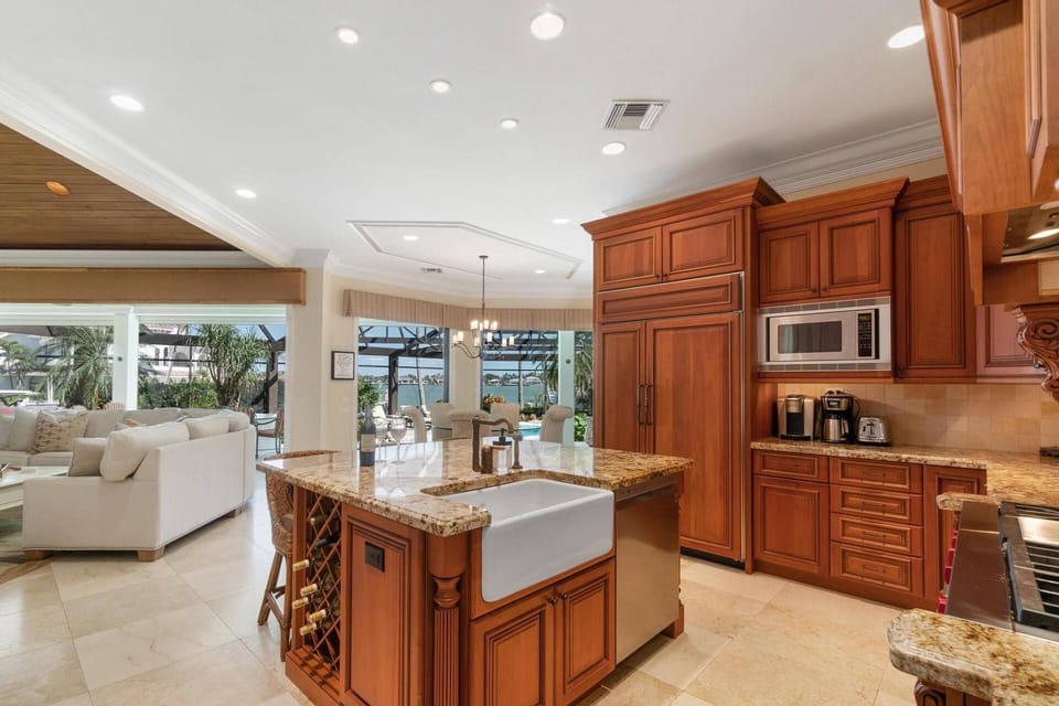 The custom kitchen is fully stocked, featuring high-end appliances and world-class views.