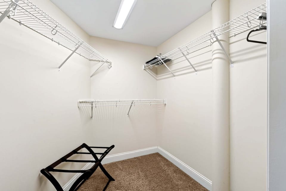 Primary bedroom walk-in closet.
