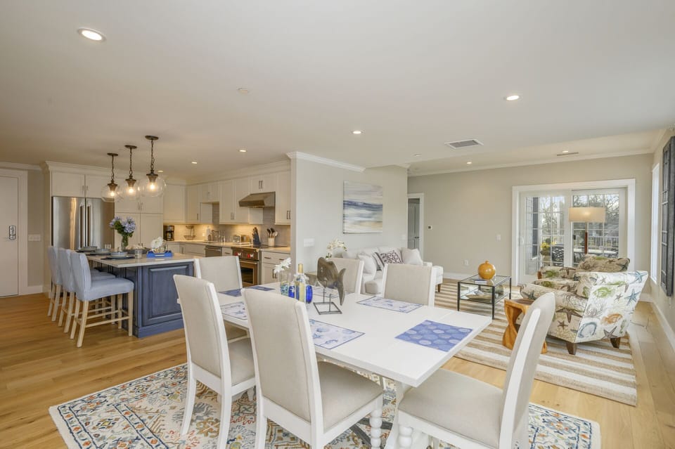 Open Concept Dining/ living area with seating for 6. Entrance to private outdoor patio.