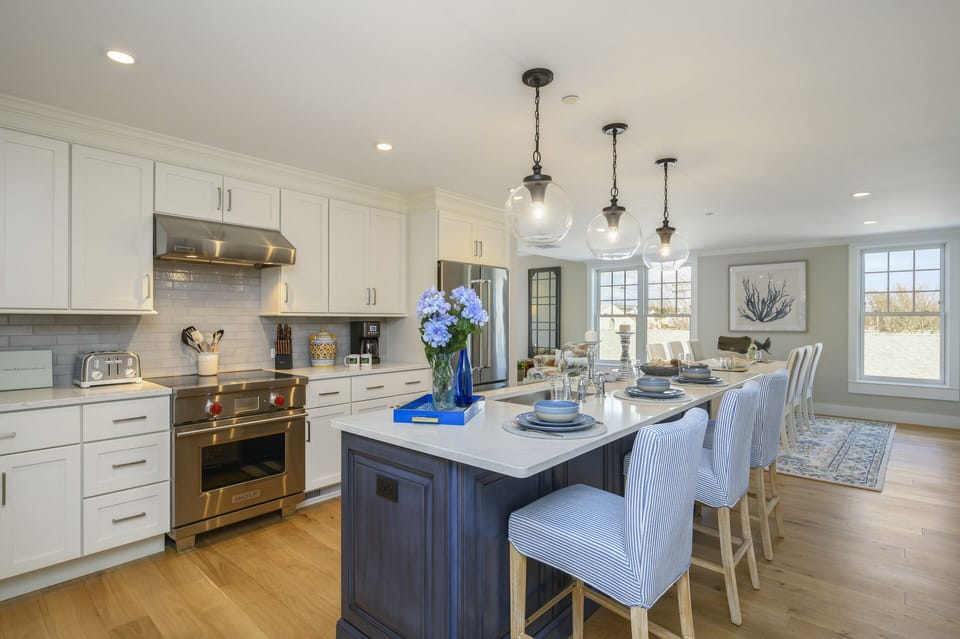 Open concept Kitchen - Dining area beyond, kitchen island with seating for 3.