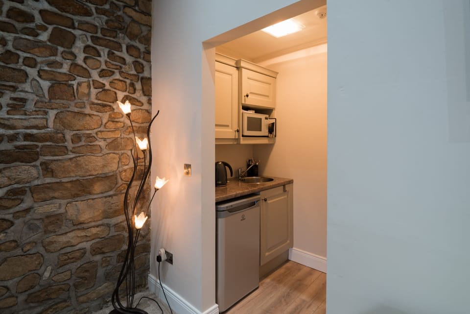 Your kitchenette with Welcome pack of Tea, Coffee , Cereals .