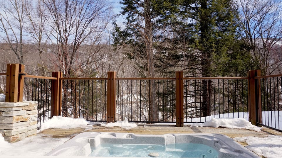 Private outdoor hot tub surrounded by nature