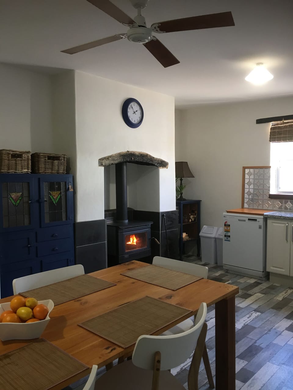Kitchen/Dining room with combustion fire. 