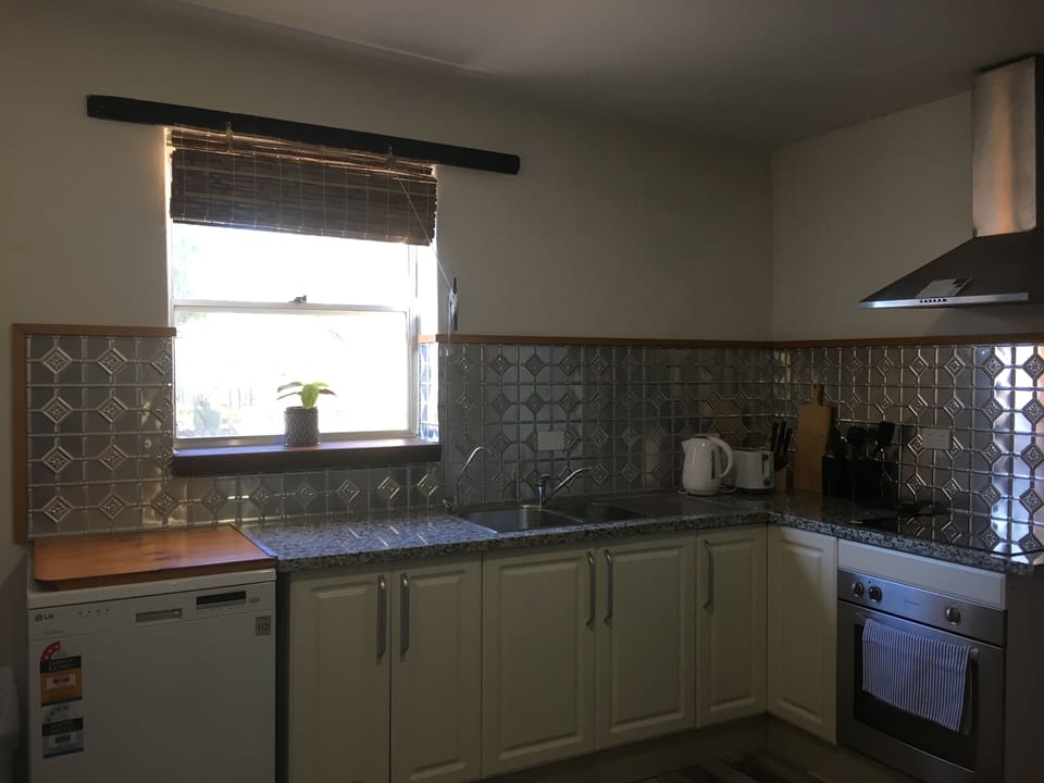 Kitchen along with dishwasher, oven, microwave, pura tap and all cookware etc