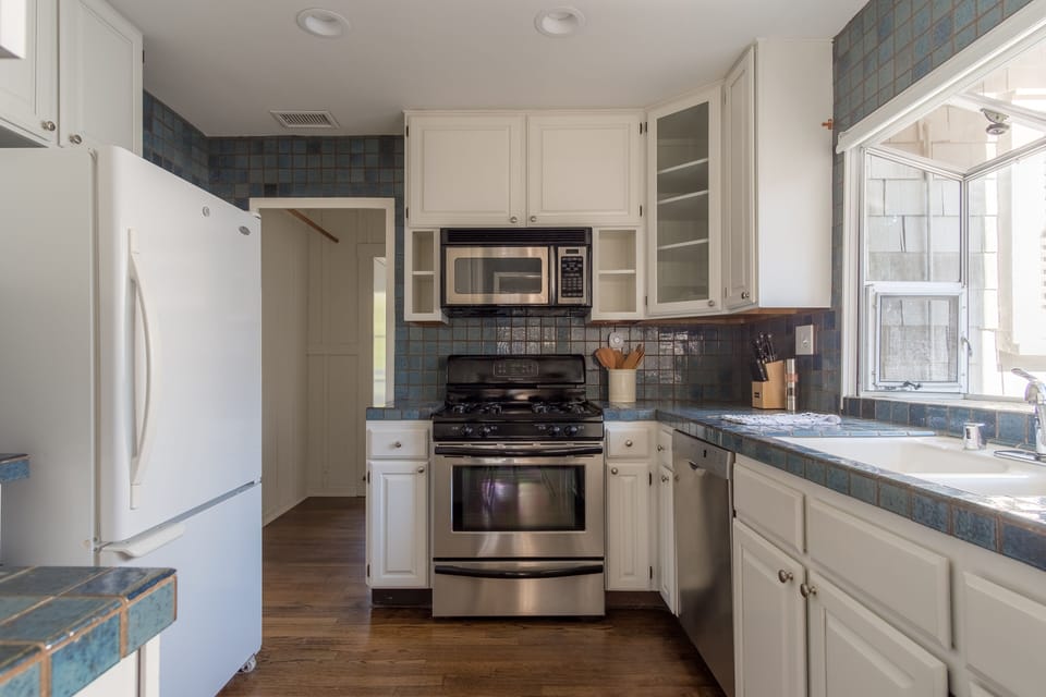 Kitchen features modern appliances.