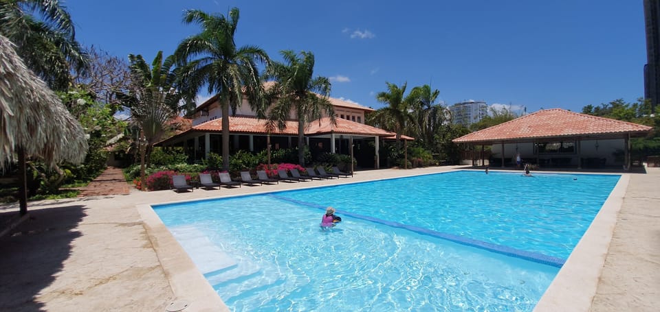 Main pool & clubhouse with reading and game room, movie theatre and restaurant.