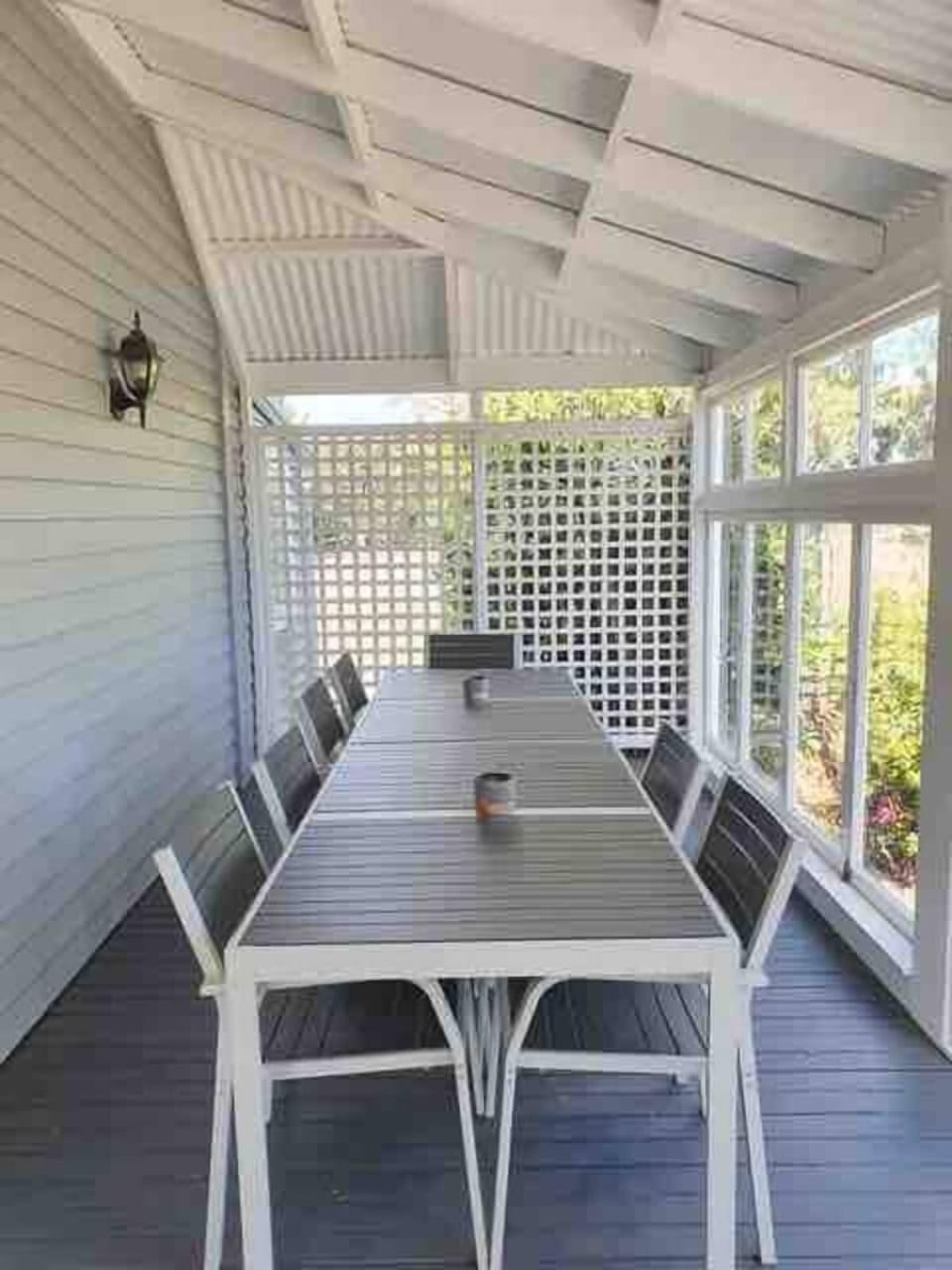 The enclosed verandah offers additional space for dining and lounging (outdoor loungers not shown) 