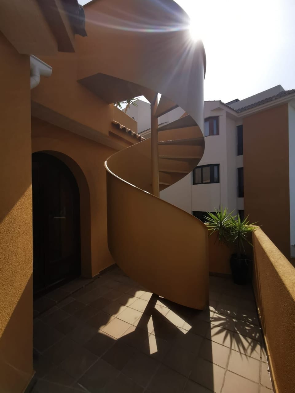 Spiral staircase leading to roof Solarium 