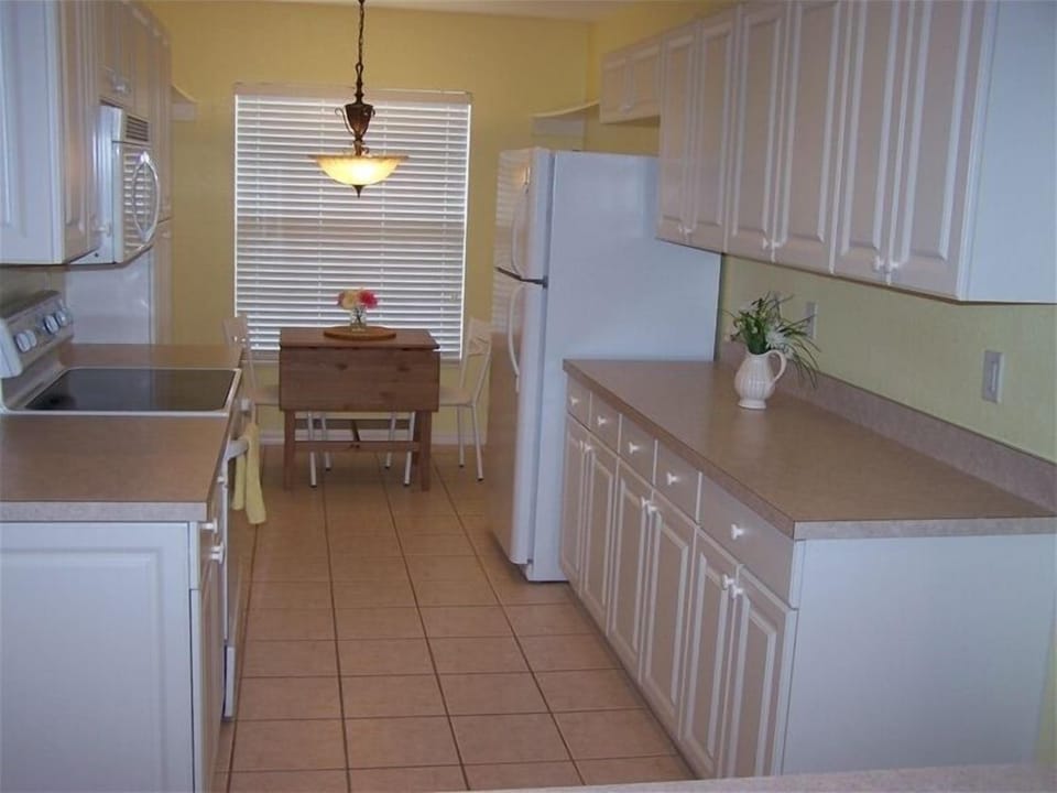 Kitchen with breakfast nook for morning sunshine.